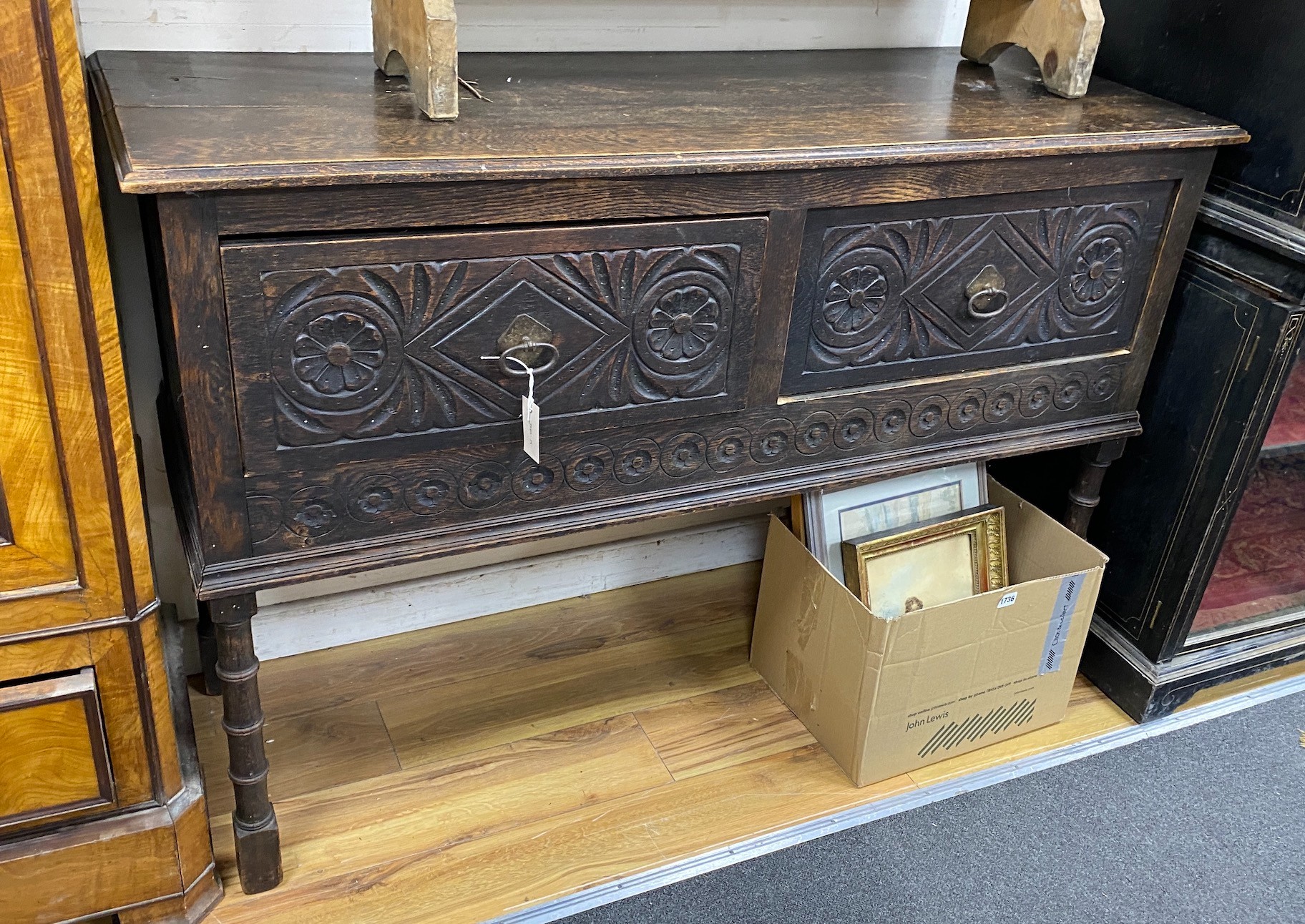 An early 20th century Jacobean revival oak low dresser, width 138cm, depth 48cm, height 93cm